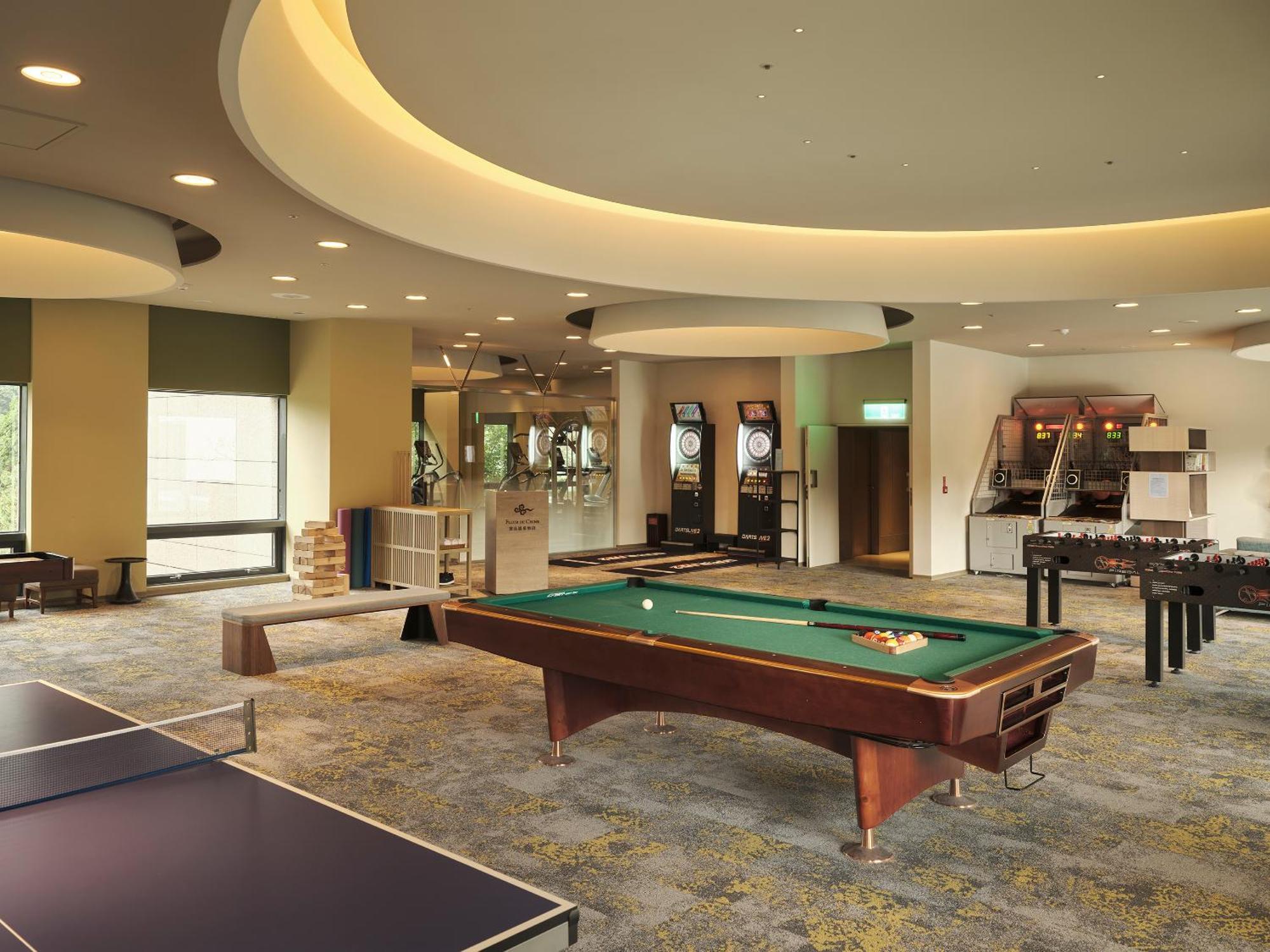 Fleur De Chine Hotel Yuchi Exteriér fotografie The game room at the clubhouse